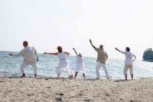 People on Beach Doing Tai Chi